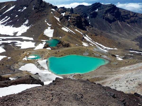 National Park Villages, blog post, Tongariro Alpine Crossing Autumn Hiking, Autumn hiking in the Tongariro - From November till May, trek across a volcanic alpine landscape of dramatic contrasts. From June to October, snow and ice means alpine skills and experience are essential - it's best to go with a guide or choose another track.